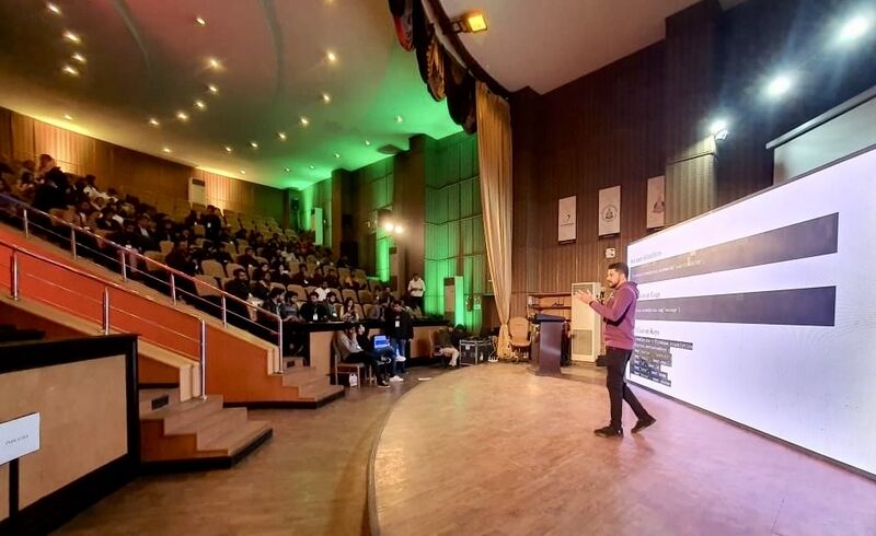 Abid Jamil speaking to an auditorium audience at DevFest Lahore 2022